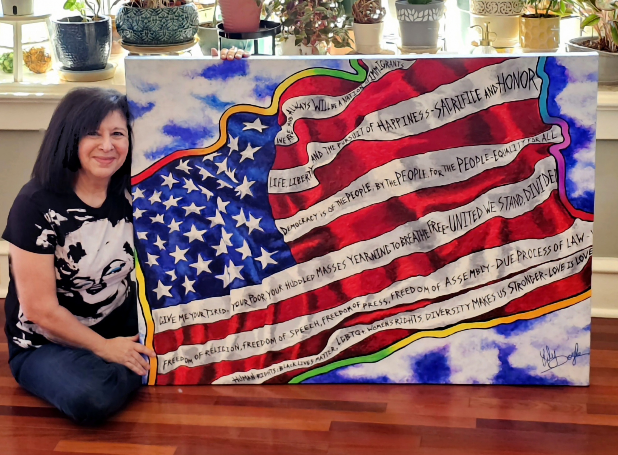 Lily Doyle with Still Our Flag Painting